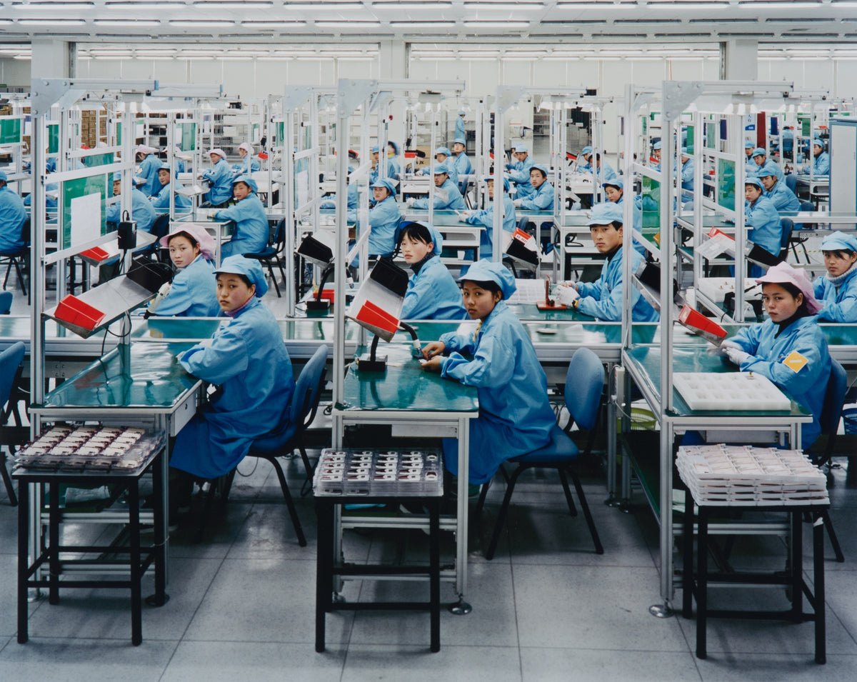 Edward Burtynsky, Manufacturing #15, Bird Mobile, Nigbo, Zhejiang, Province, 2005. Image of factory workers in China looking at the camera. View 1 of 2.