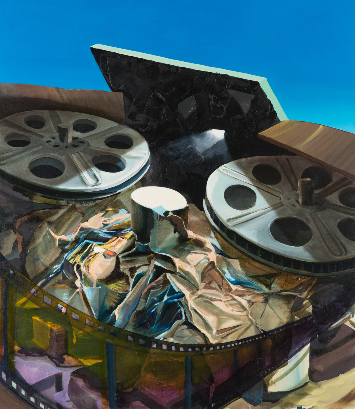 Etienne Zack, Studio Recording, 2010. Still-life of two film reels among other equipment against a blue background.