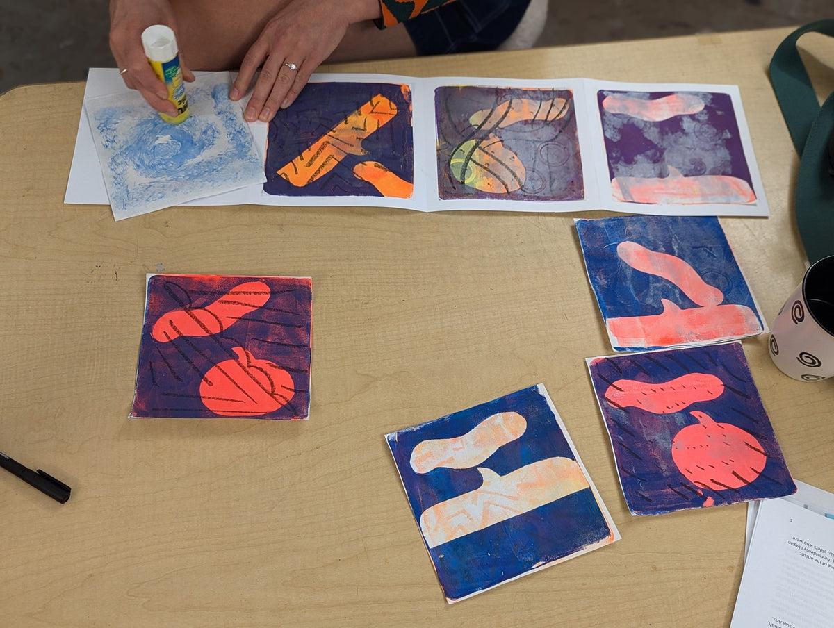 Colourful gel plate monoprints of shapes laid out on a table, with a four-panel comic