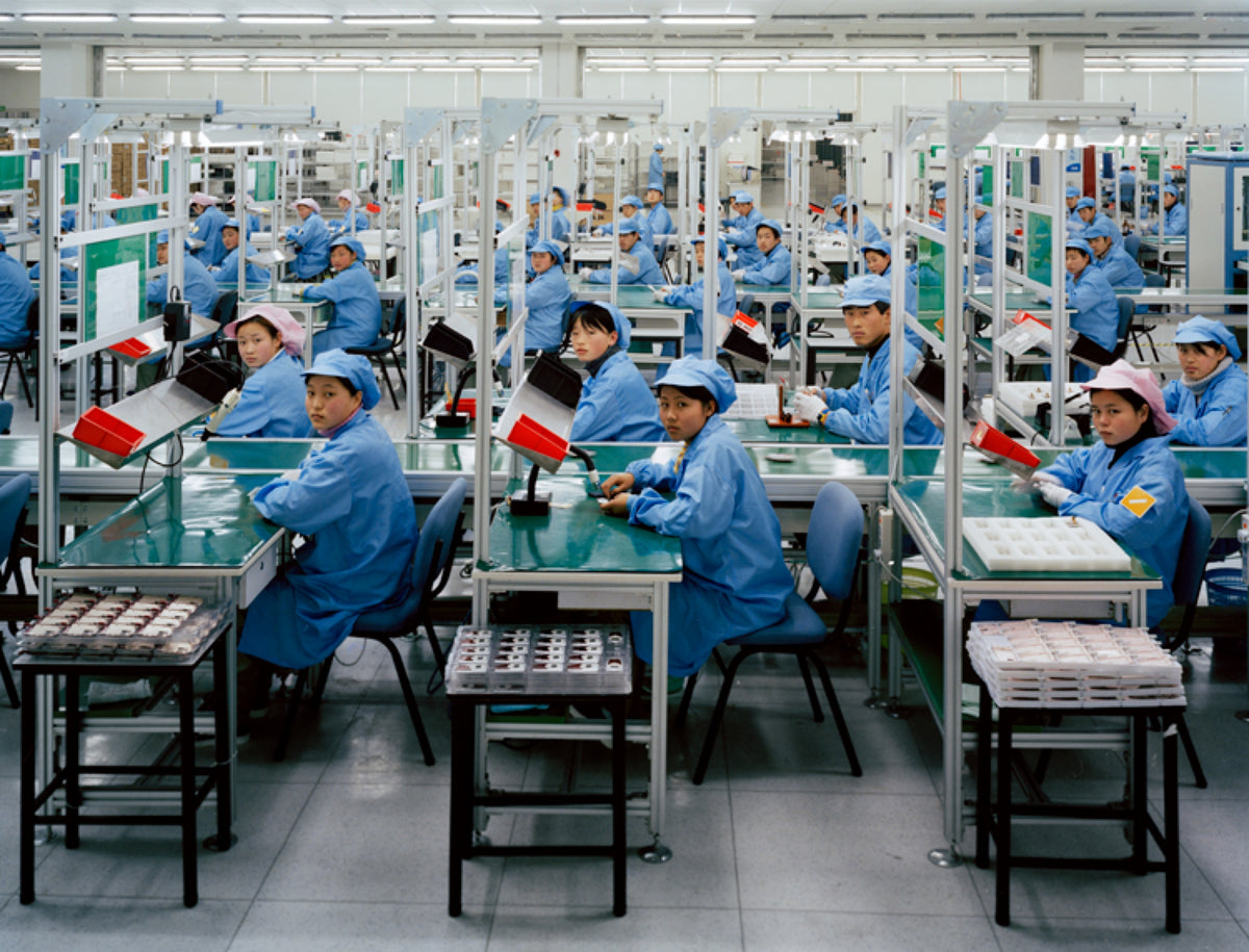 Edward Burtynsky, Manufacturing #15, Bird Mobile, Nigbo, Zhejiang, Province, 2005. Image of factory workers in China looking at the camera. View 2 of 2.