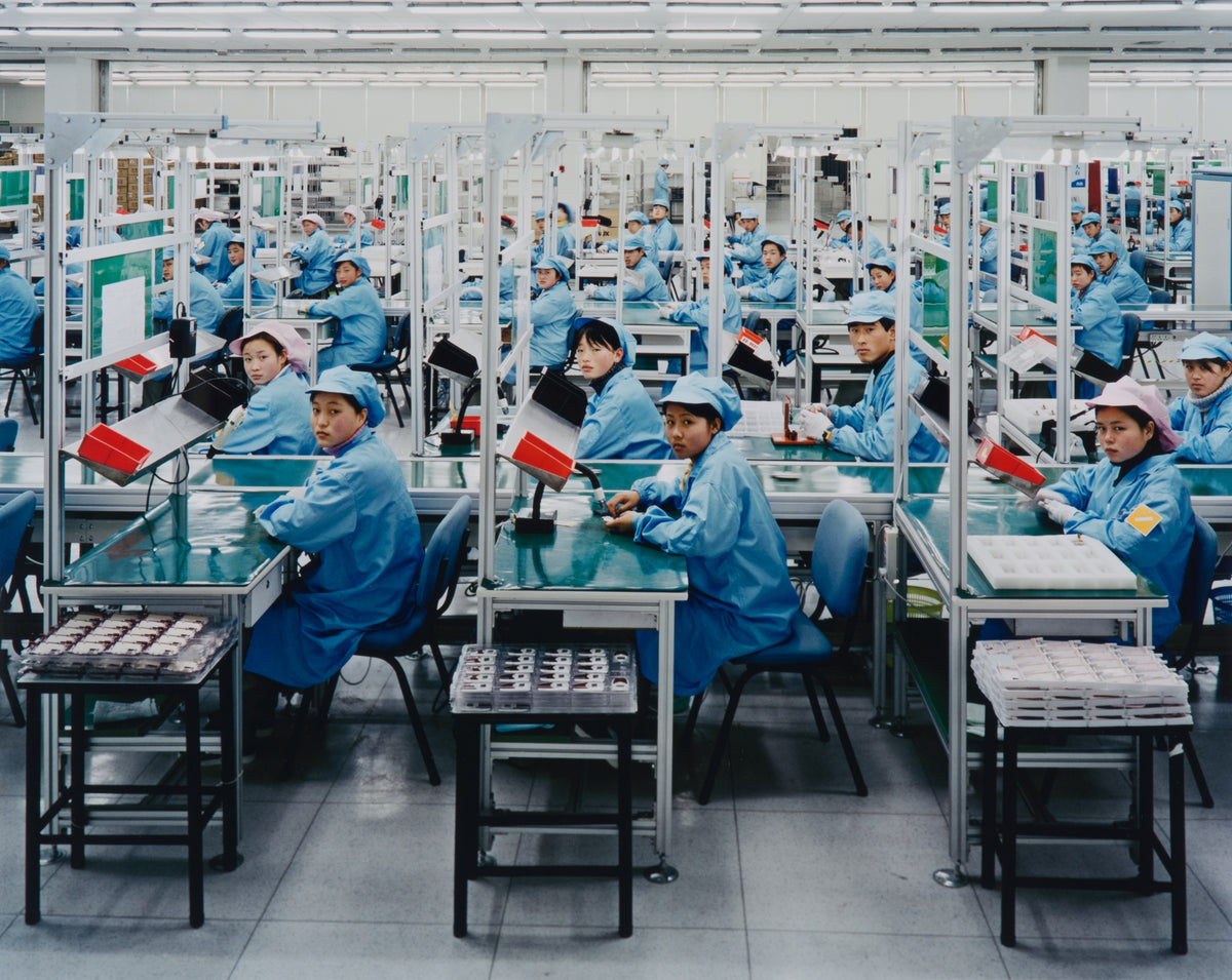 Edward Burtynsky, Manufacturing #15, Bird Mobile, Nigbo, Zhejiang, Province, 2005. Image of factory workers in China looking at the camera. View 2 of 2.