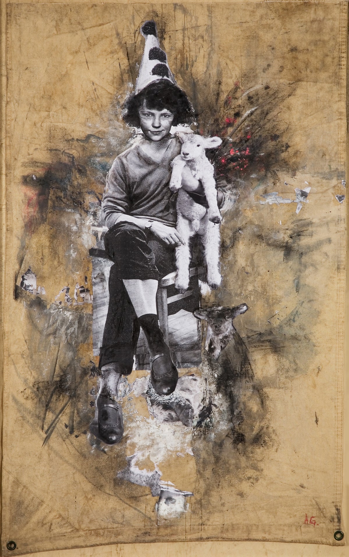 Angela Grossmann, Black Sheep, 2008. Black and white image of a girl with a pointed hat, holding a lamb while seating a chair. View 1 of 2.
