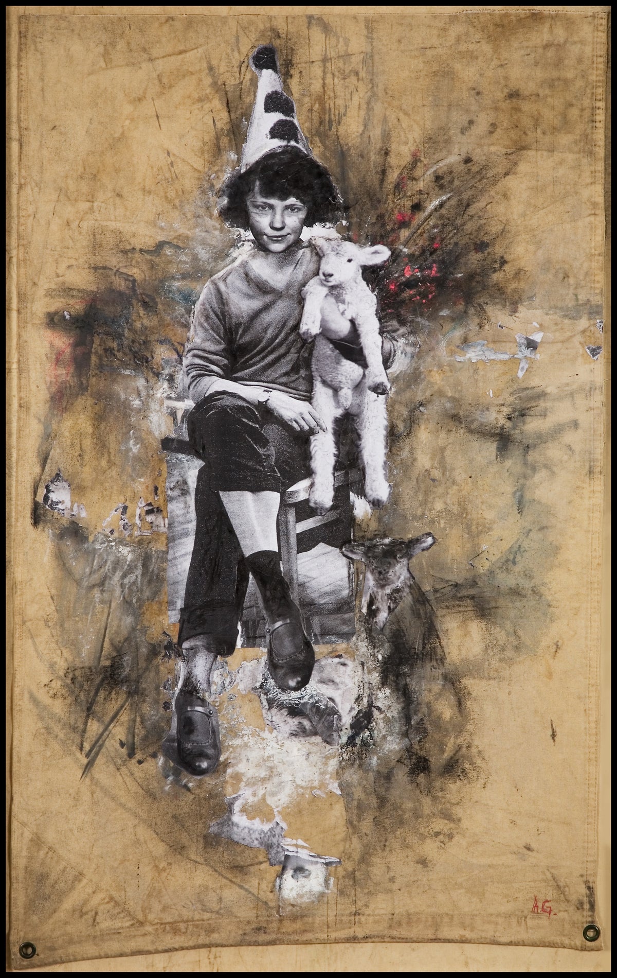 Angela Grossmann, Black Sheep, 2008. Black and white image of a girl with a pointed hat, holding a lamb while seating a chair. View 2 of 2.