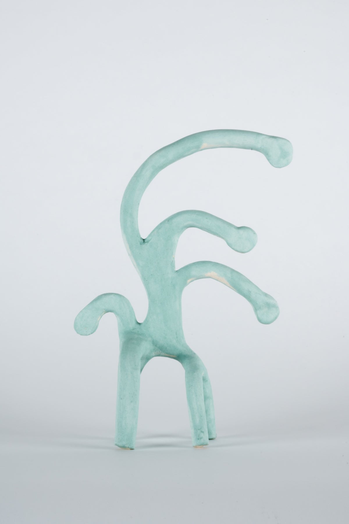 Parvin Peivandi, Utopian Rug, 2023. Ceramic figurative sculptures in soft green, yellow, pink and orange. View 2 of 24.