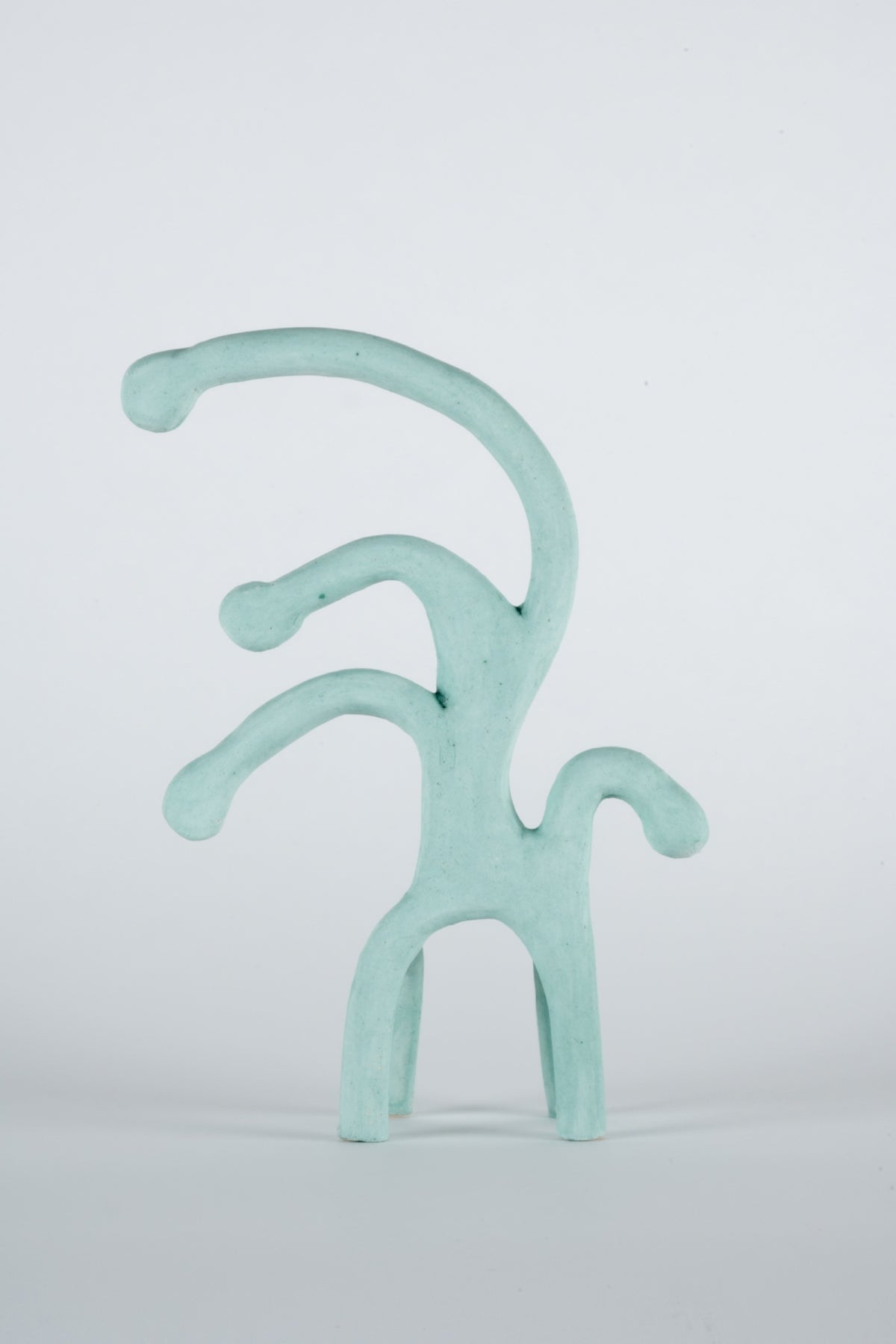 Parvin Peivandi, Utopian Rug, 2023. Ceramic figurative sculptures in soft green, yellow, pink and orange. View 3 of 24.